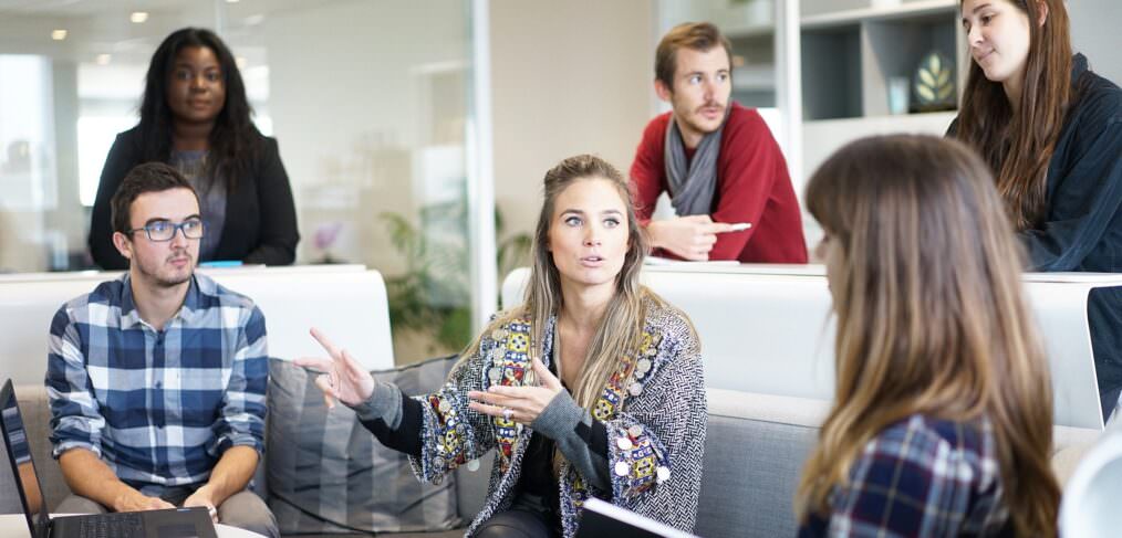 a team at work figuring out how to keep employees engaged