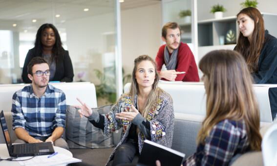 a team at work figuring out how to keep employees engaged